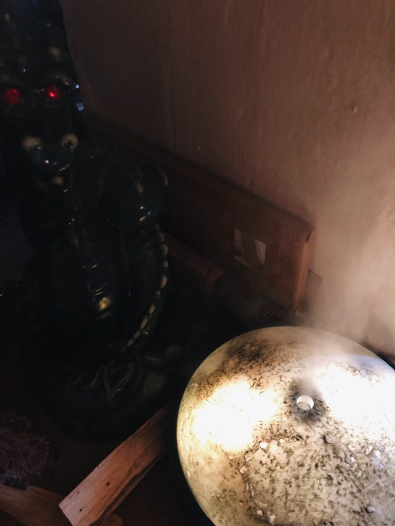 Moon light up diffuser with dragon candle in background. 